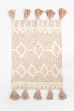 Beige badmat met geometrische figuren