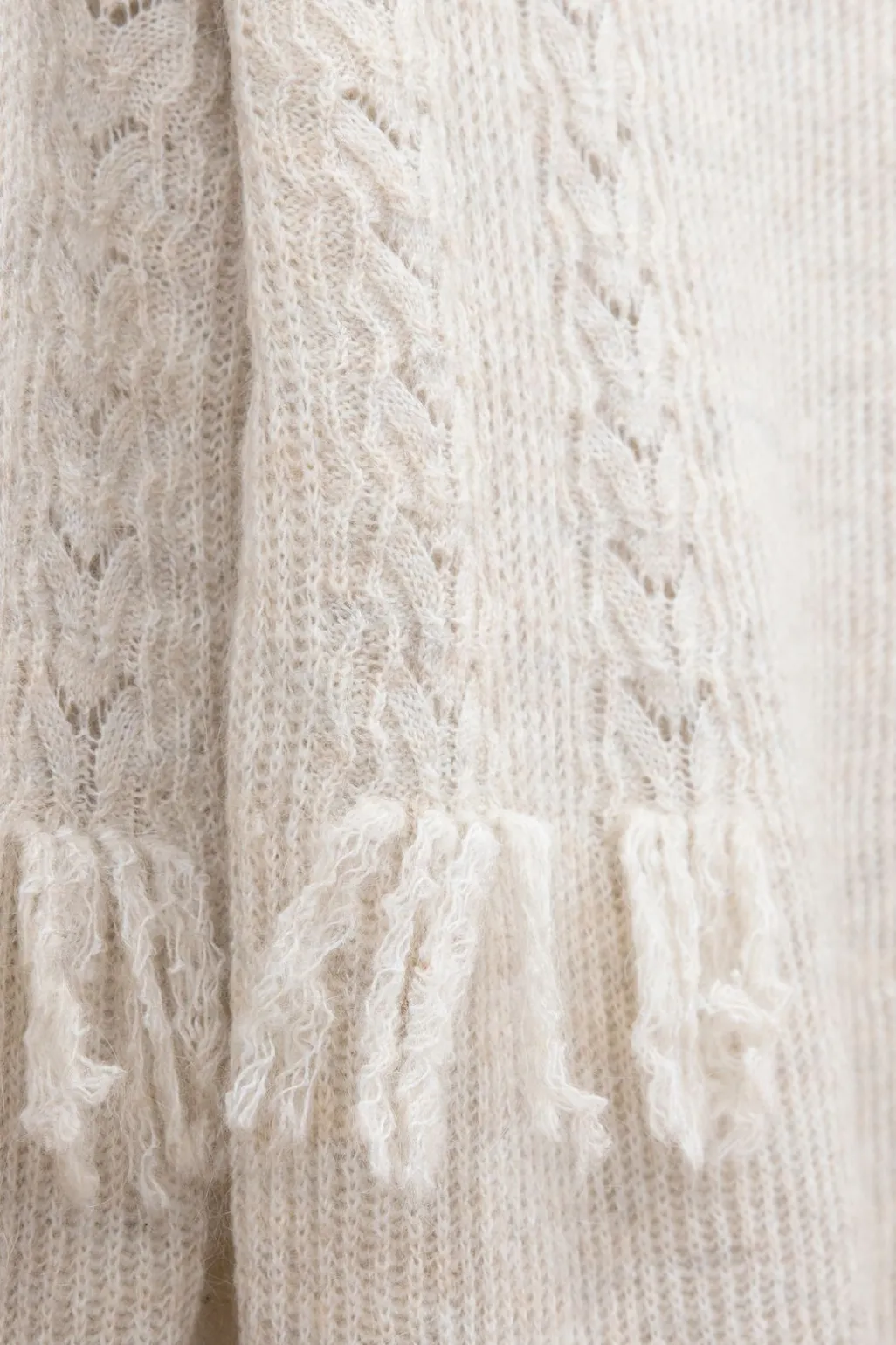 Beige gebreide tuniek met franjes