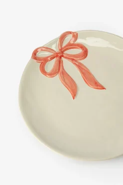 Beige ontbijtbord met roze strik