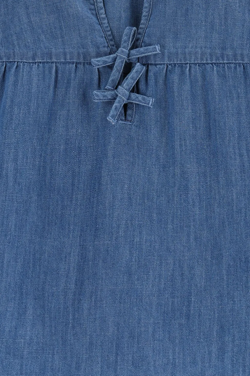 Blauwe denim blouse met strikjes