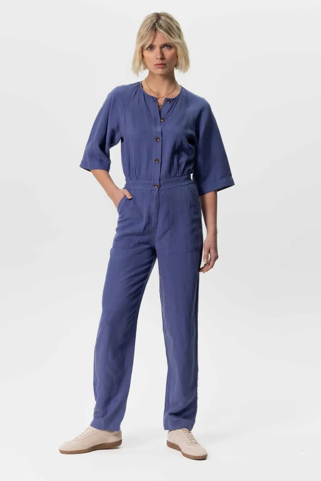 Blauwe jumpsuit met knopen