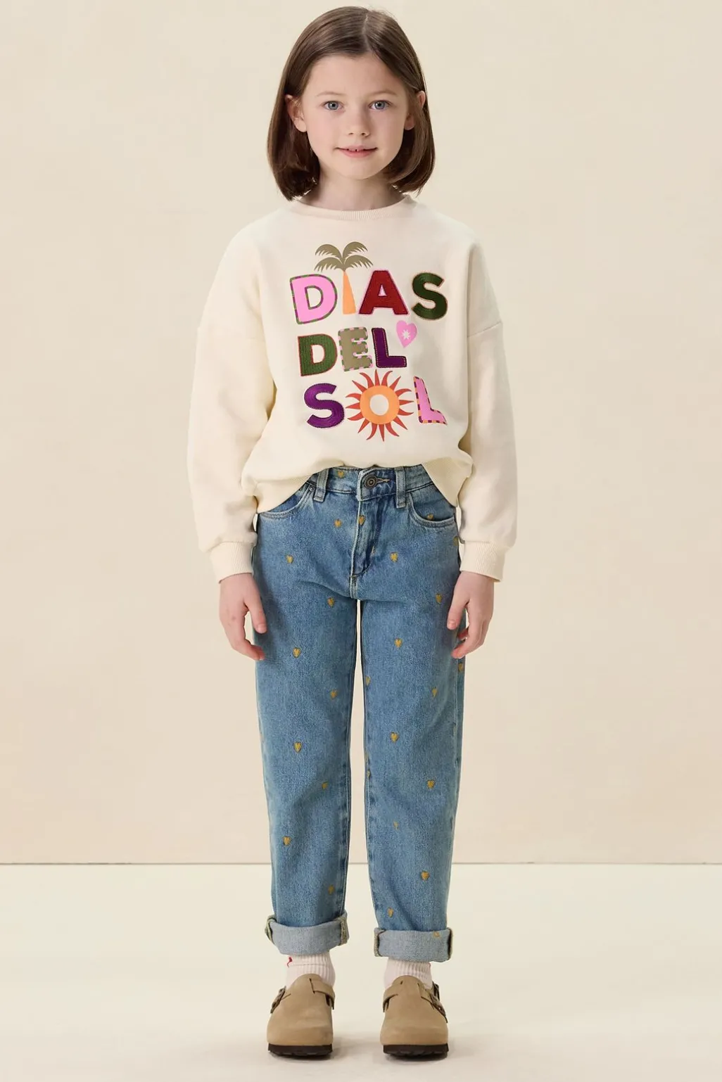 Blauwe tapered jeans met hartjes embroidery