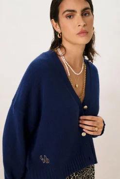 Donkerblauw vest met gouden knopen