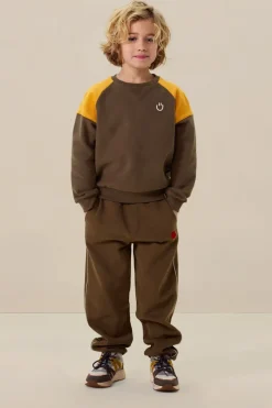 Donkergroene colourblock sweater met artwork