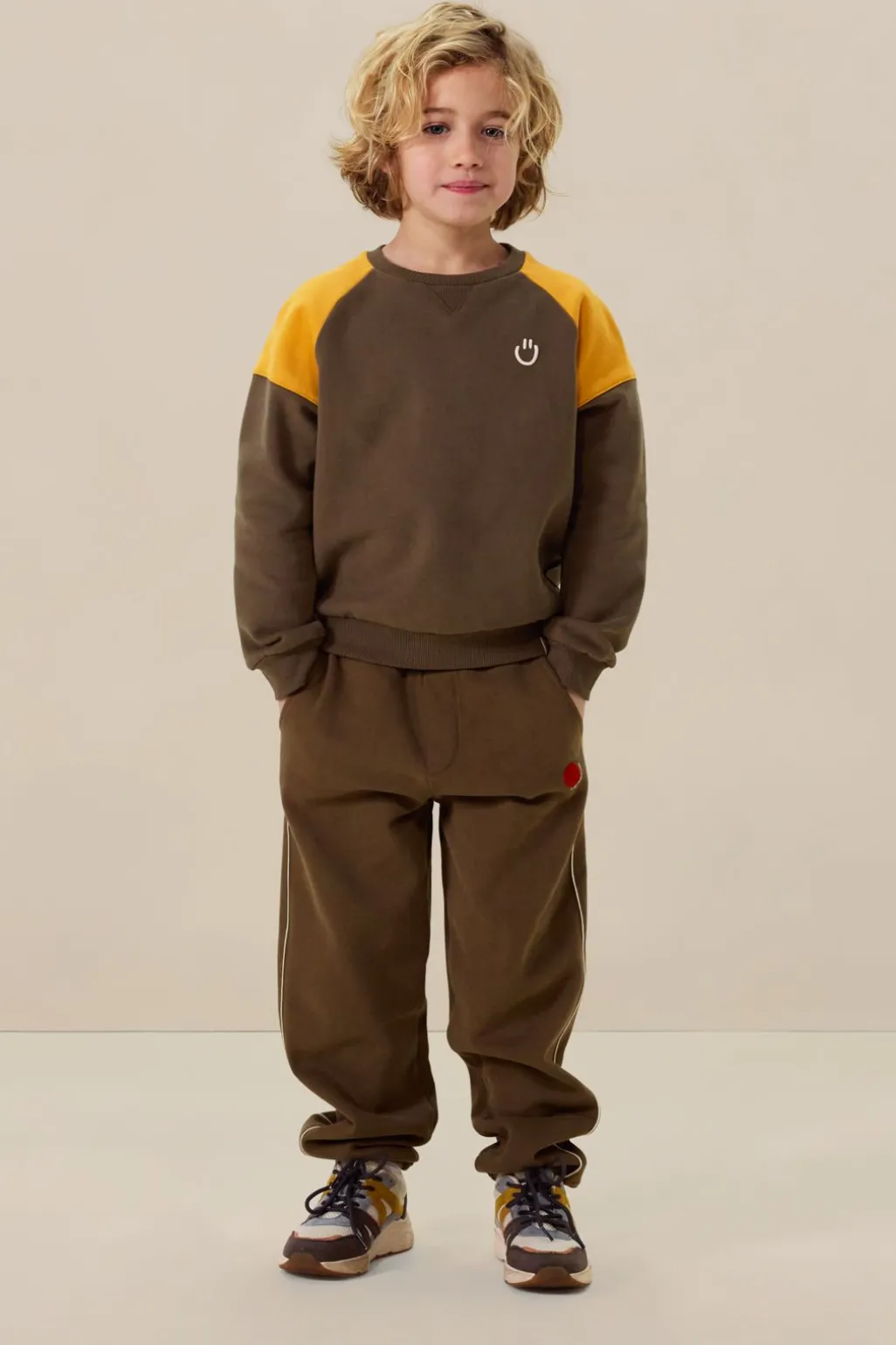 Donkergroene colourblock sweater met artwork