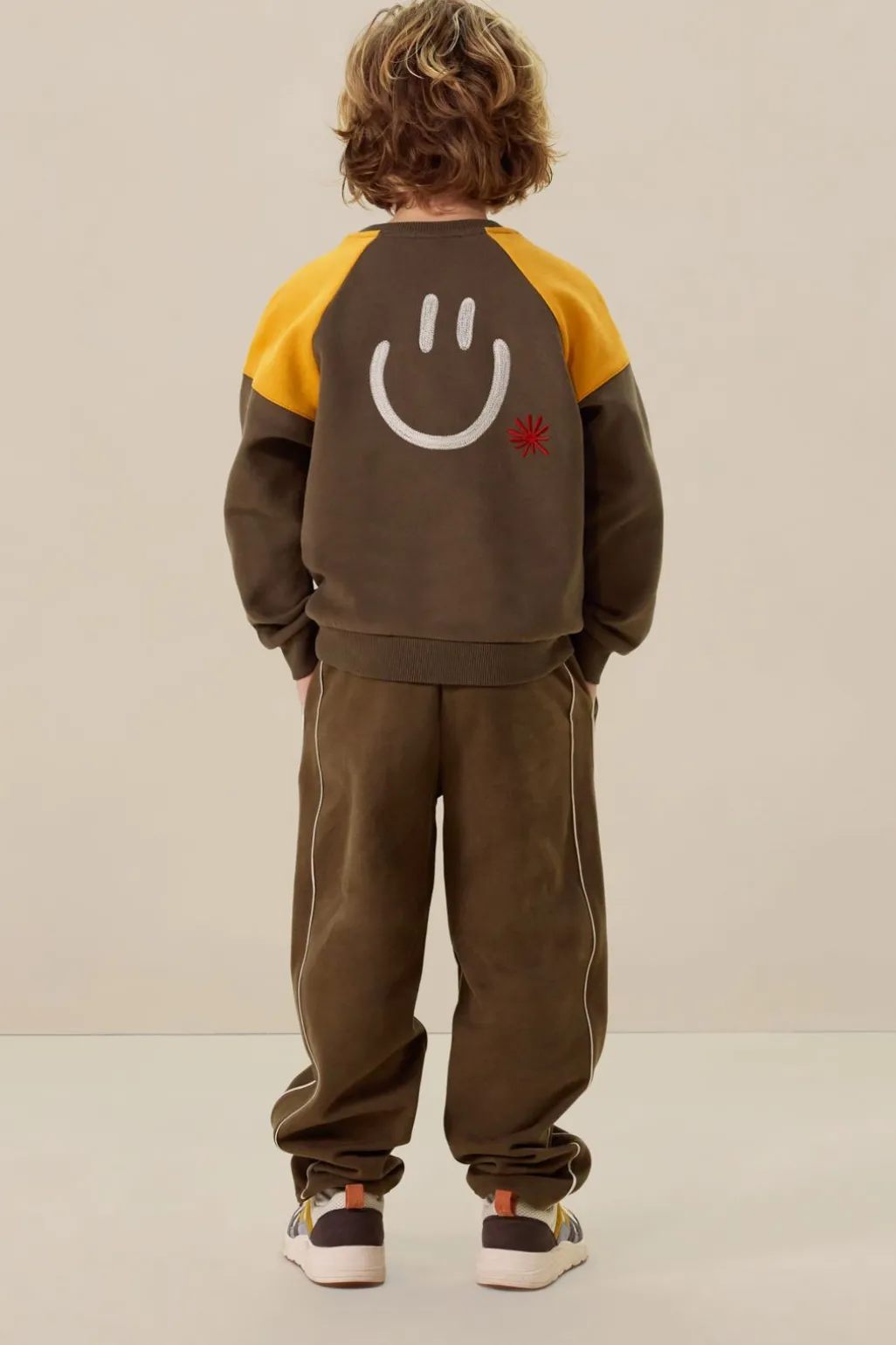 Donkergroene colourblock sweater met artwork