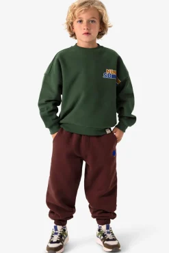 Donkergroene sweater met artwork