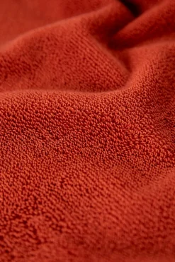 Donkeroranje handdoek en theedoek