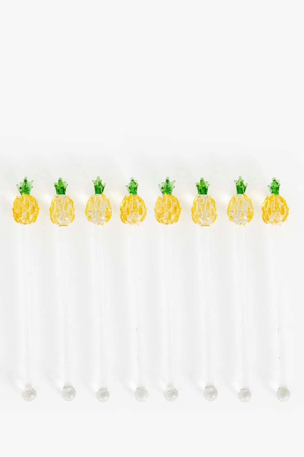 Glazen cocktail roerstaafje met ananas