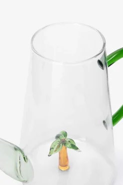 Glazen gieter met palmboom