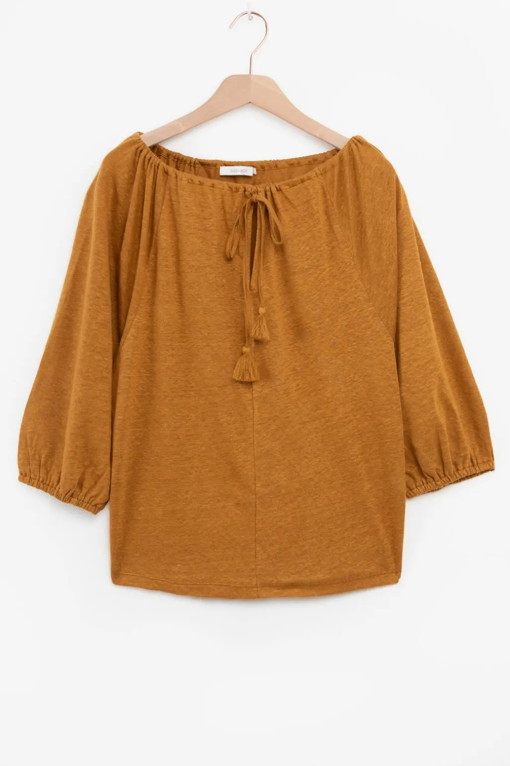 Goudbruine top met kwastjes
