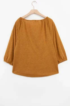 Goudbruine top met kwastjes
