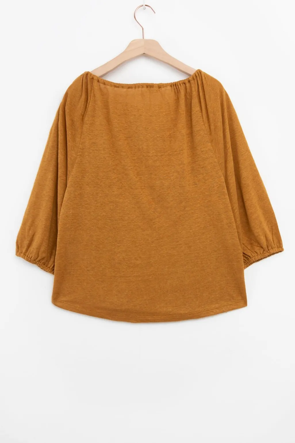 Goudbruine top met kwastjes