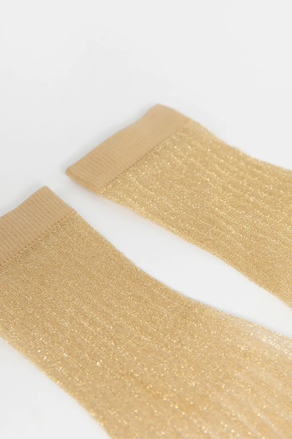 Gouden sheer glittersokken met rib