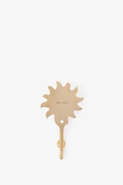 Goudkleurige wandhaak zon