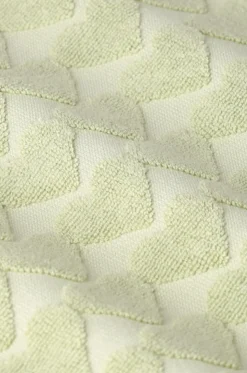 Lichtgroene handdoek met hartjes print