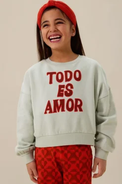 Lichtgroene sweater met tekst