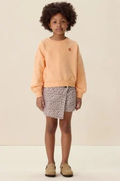 Lichtoranje sweater met artwork