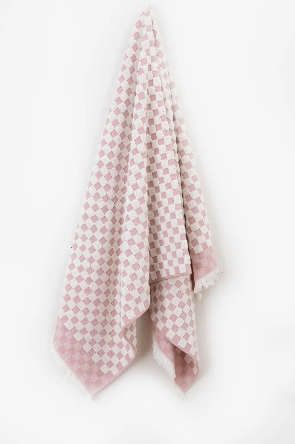 Lichtroze geblokte handdoek