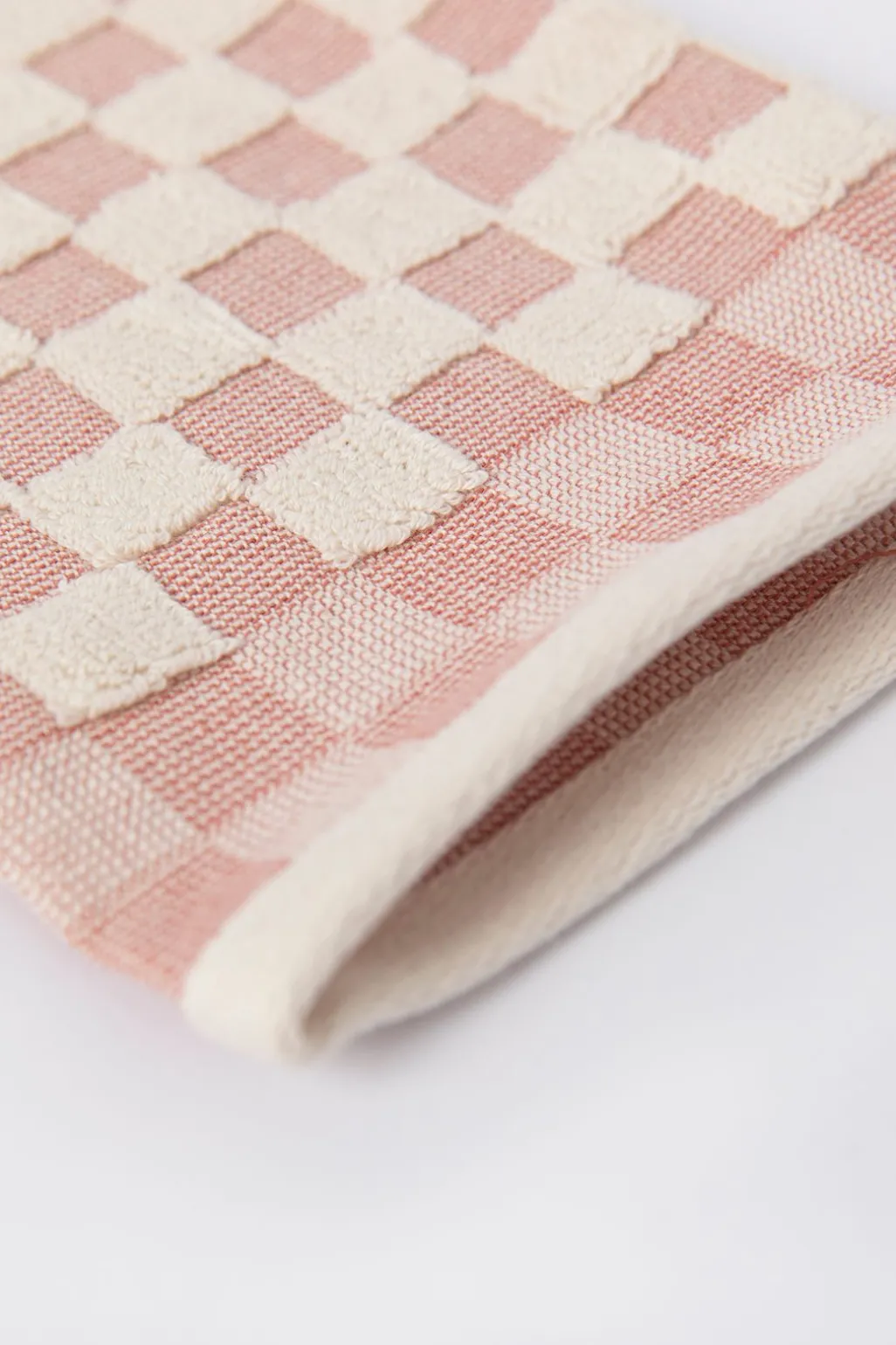 Lichtroze geblokte washand