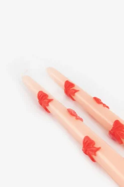 Lichtroze sierkaarsen met strikjes