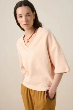 Lichtroze sweater met V-hals