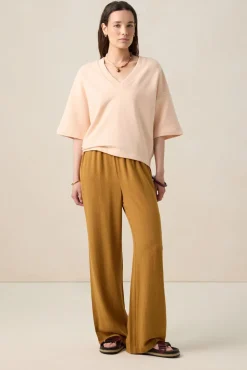 Lichtroze sweater met V-hals
