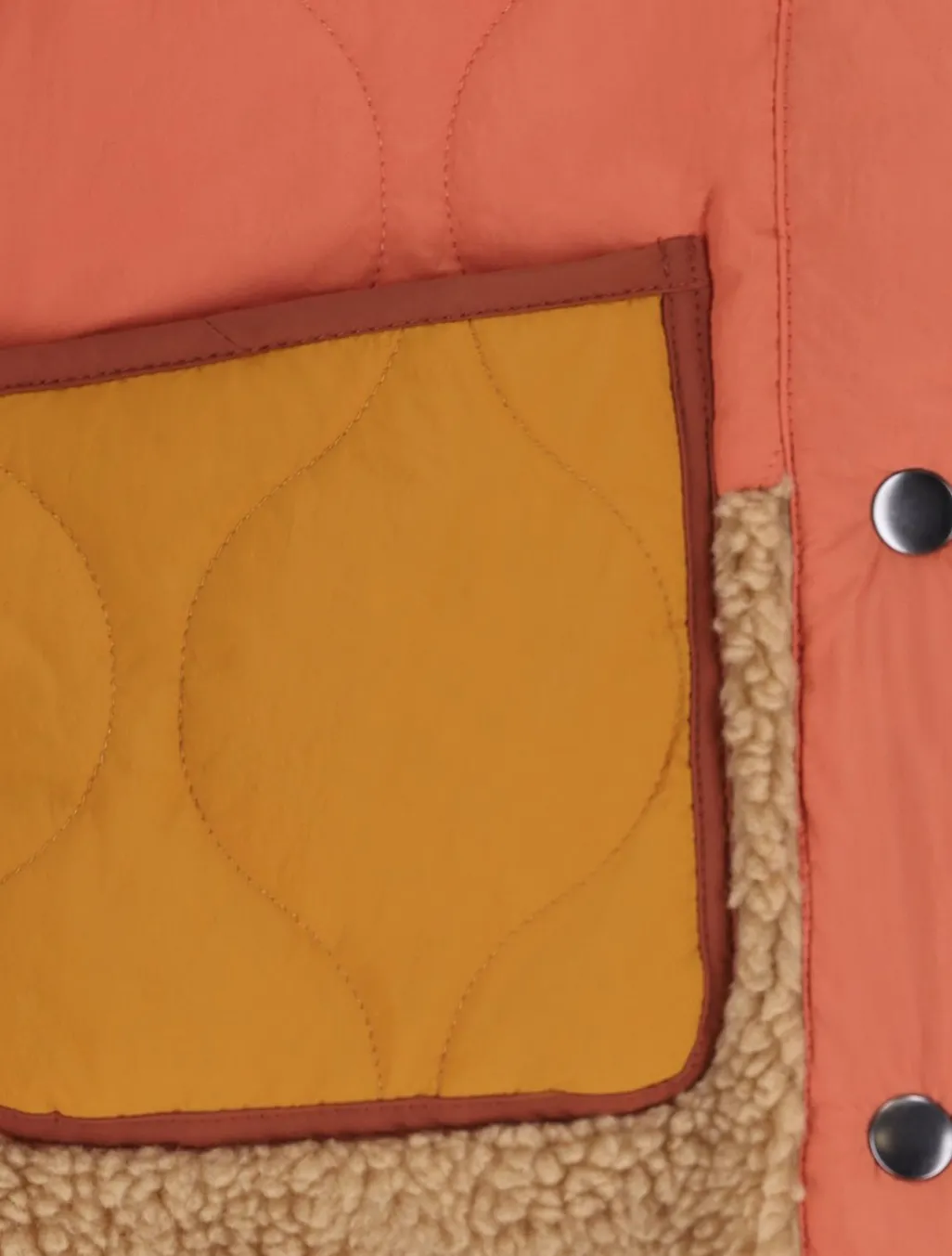 Oranje doorgestikt jack met teddy details