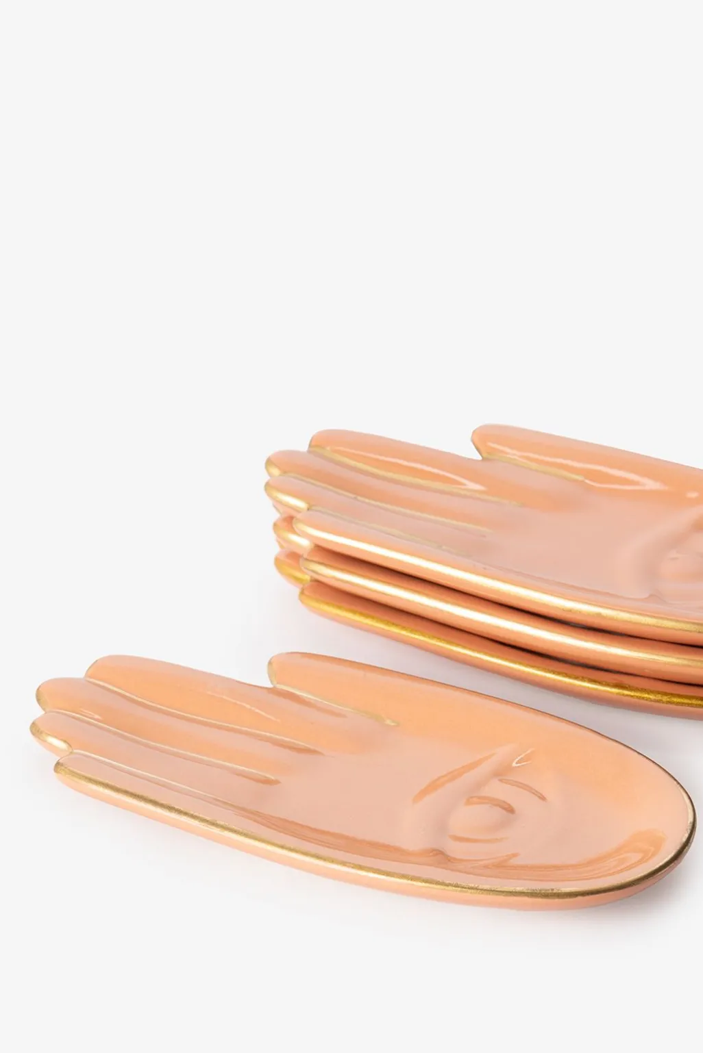 Oranje gebaksbordjes hand