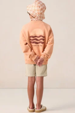 Oranje sweater met artwork