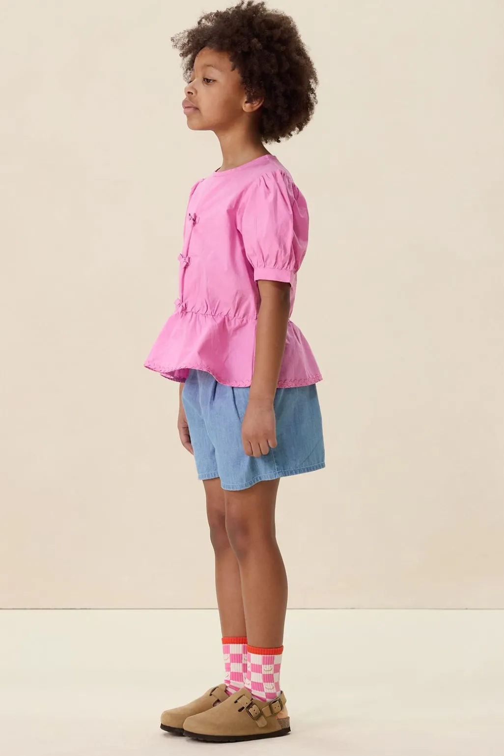 Roze blouse met striksluiting