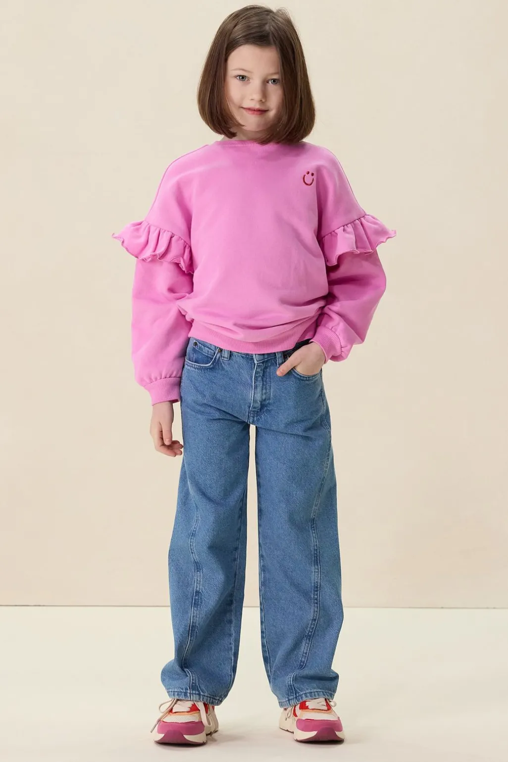 Roze oversized sweater met ruffles