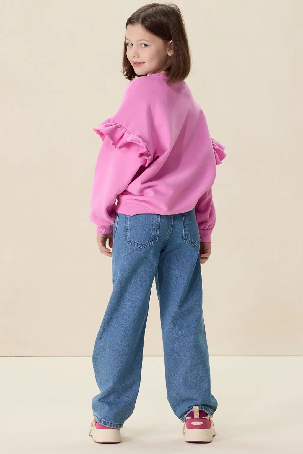 Roze oversized sweater met ruffles