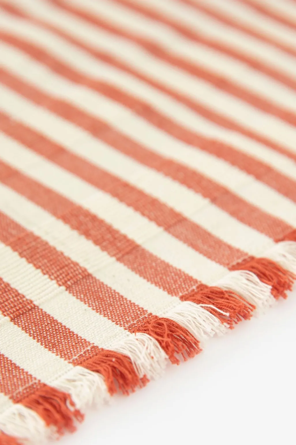 Set van 2 oranje gestreepte placemats