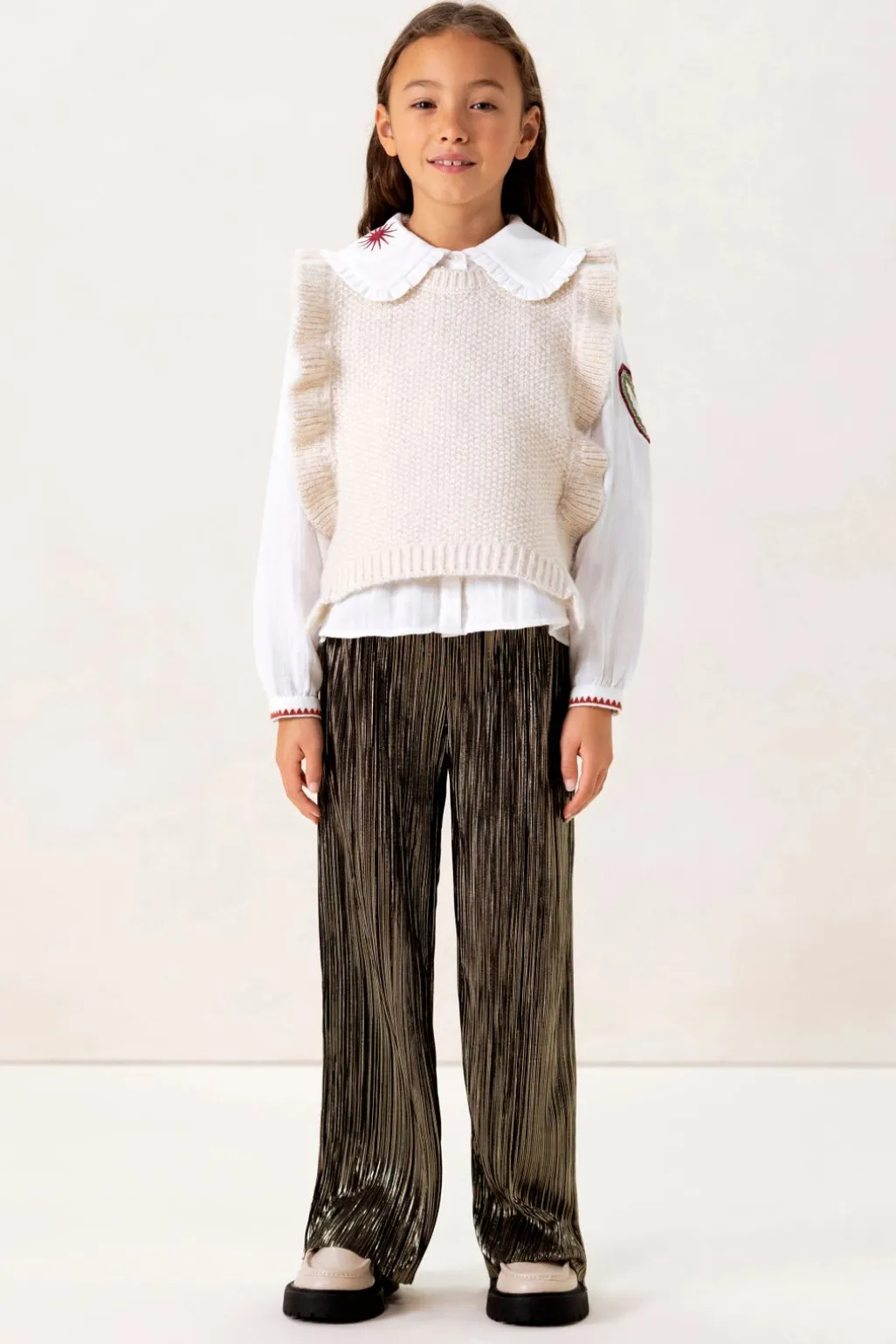 Witte gebreide spencer met ruffles