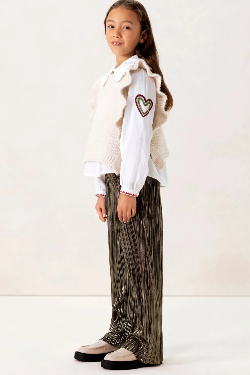 Witte gebreide spencer met ruffles