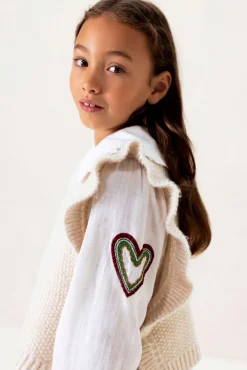 Witte gebreide spencer met ruffles