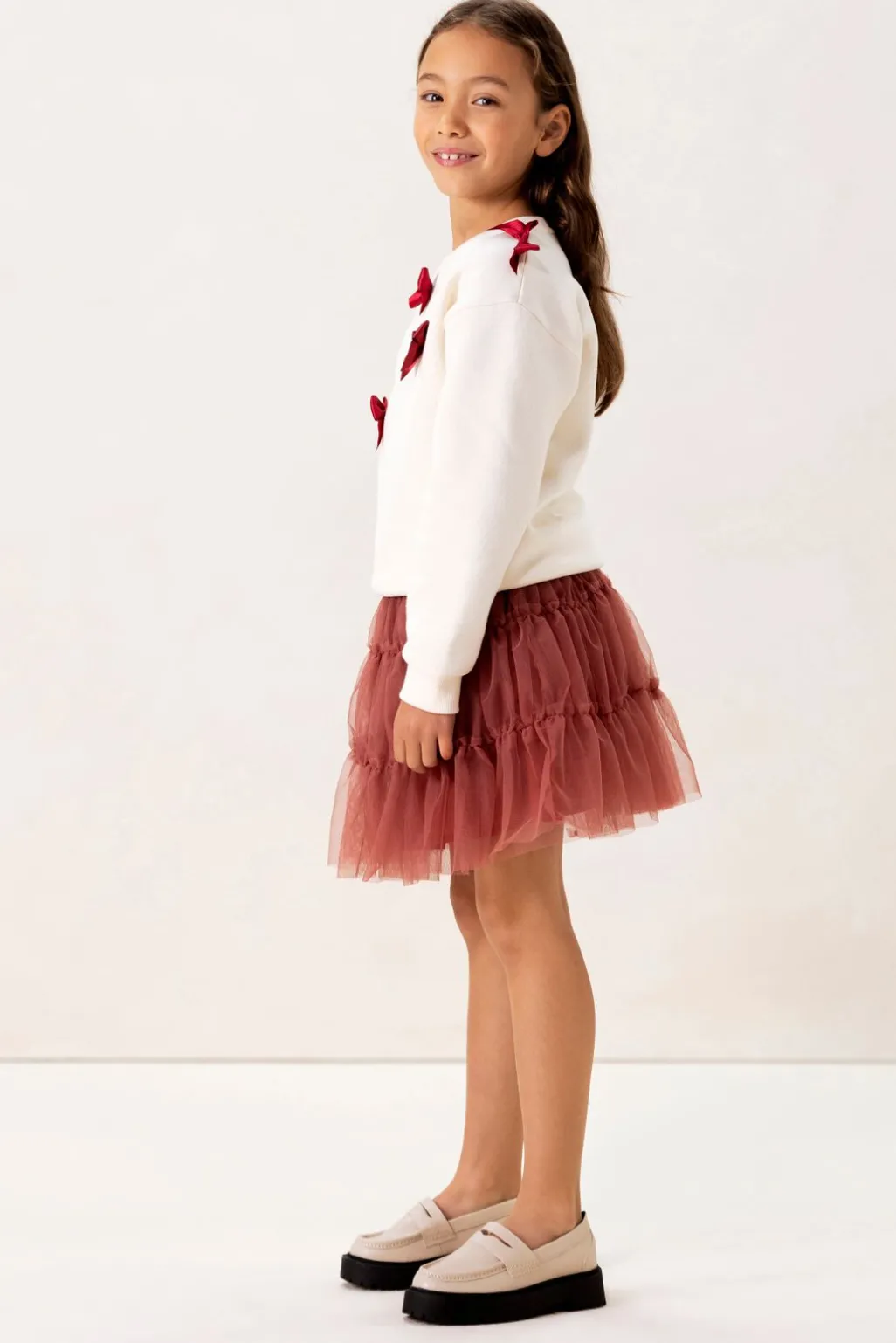 Witte sweater met strikjes