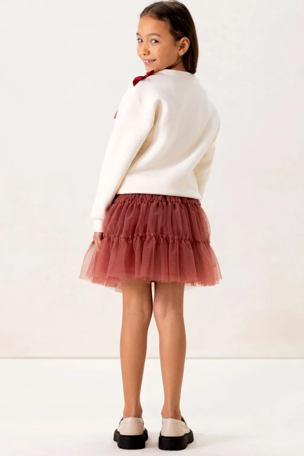 Witte sweater met strikjes