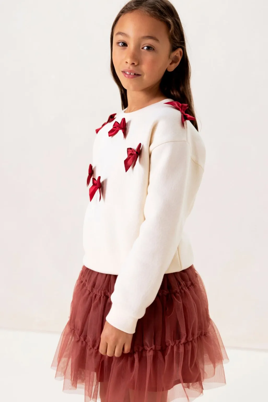 Witte sweater met strikjes
